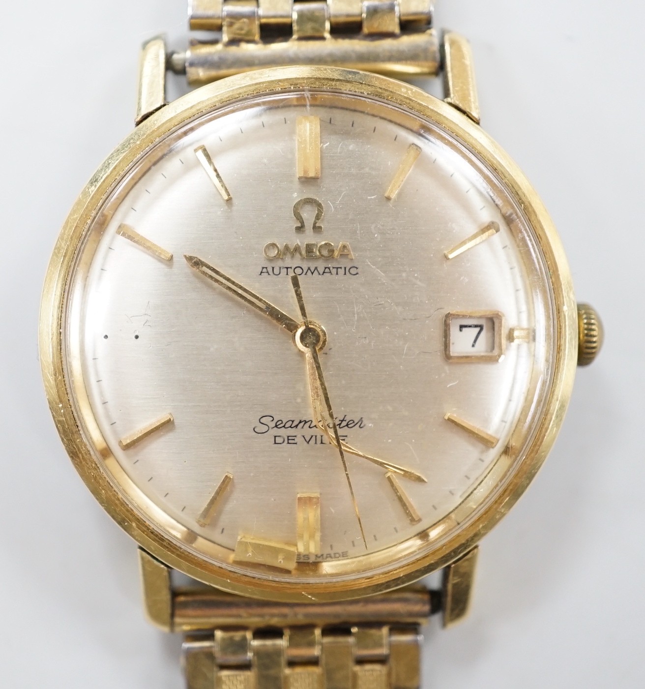 A gentleman's 1950's steel and gold plated Omega Seamaster De Ville automatic wrist watch (a.f.), movement c.355, case diameter 35mm, on associated bracelet.